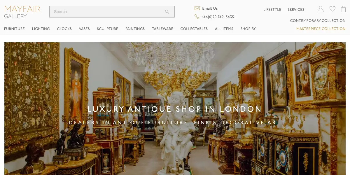The Mayfair Gallery homepage: a gallery room full of gilt antiques and paintings under a crystal chandelier, headed Luxury antique shop in London.